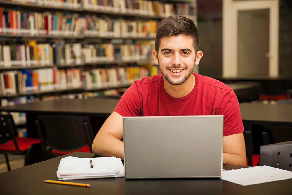 Happy student in a library